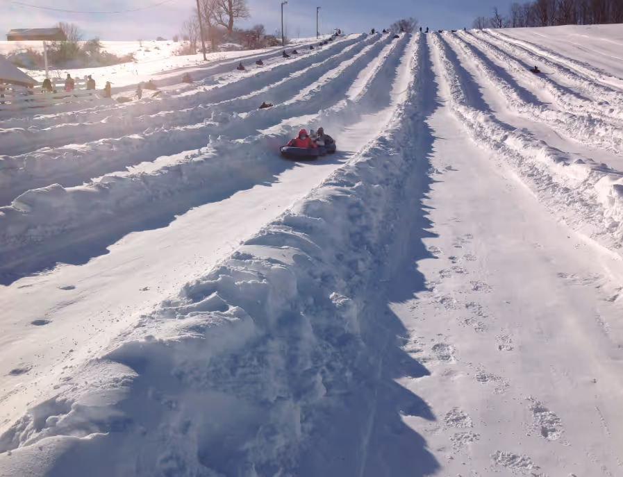 Kids tubing down hill