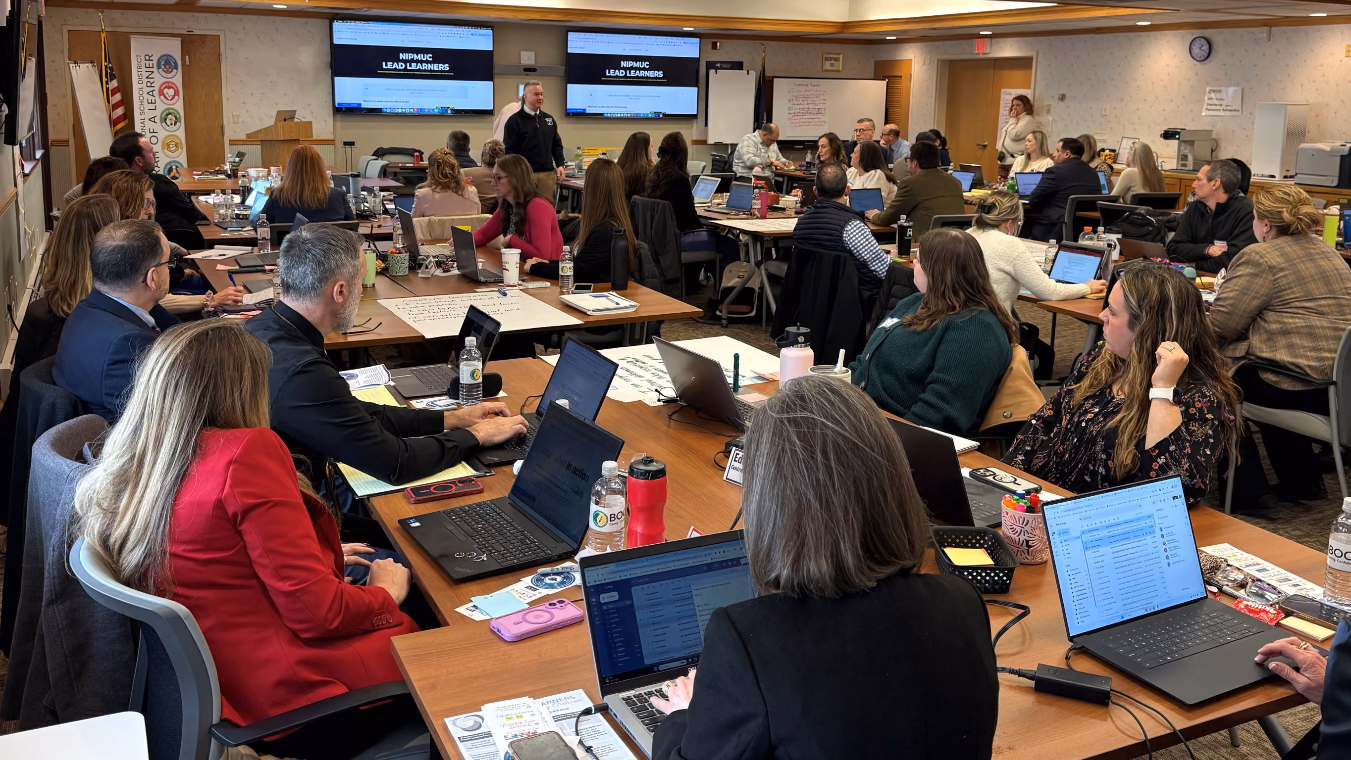 Gathering of educators in conference room
