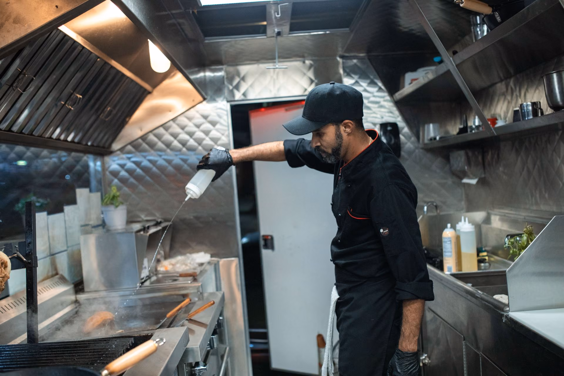 Man chopping food in kitchen