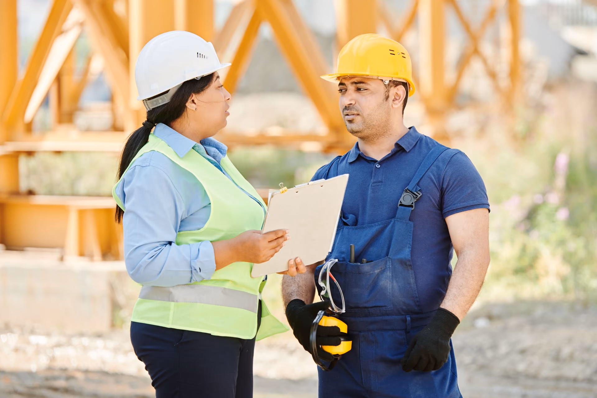 Construction workers having discussion on work site