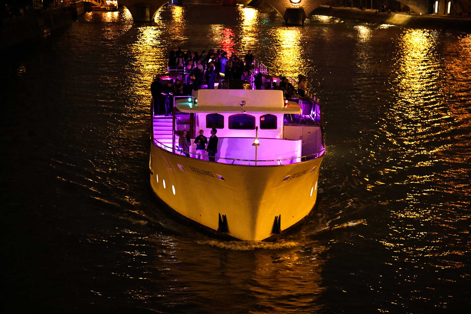 A Bateau Mouche cruising on the Seine at night
