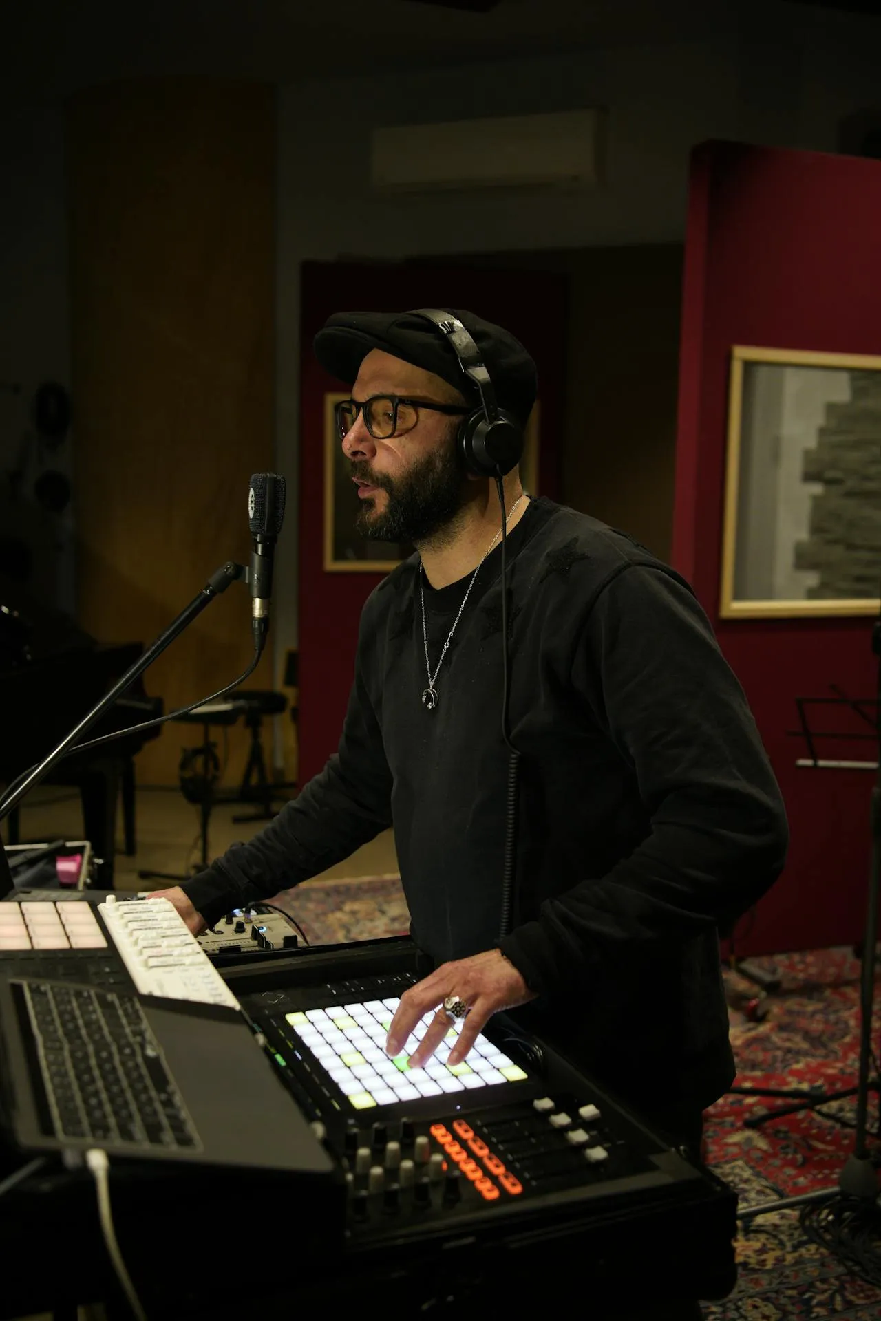 A man standing in front of a sound desk.
