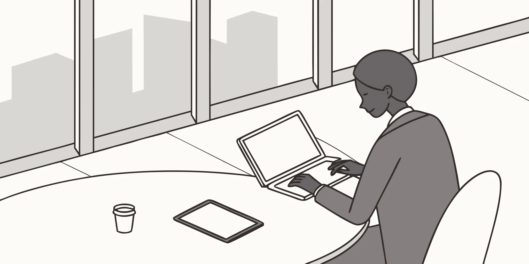 A professional writing a cold email for large companies on a laptop.