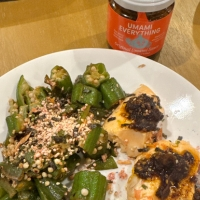 Salmon with Spicy Umami Everything with vegetables on a white plate.