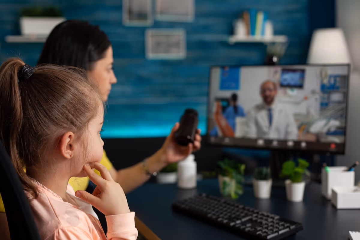 Gray stuffed bunny resting on white pillow in minimalist hospital room