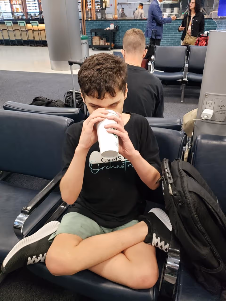 Mother and daughter happily preparing vegetables together in kitchen