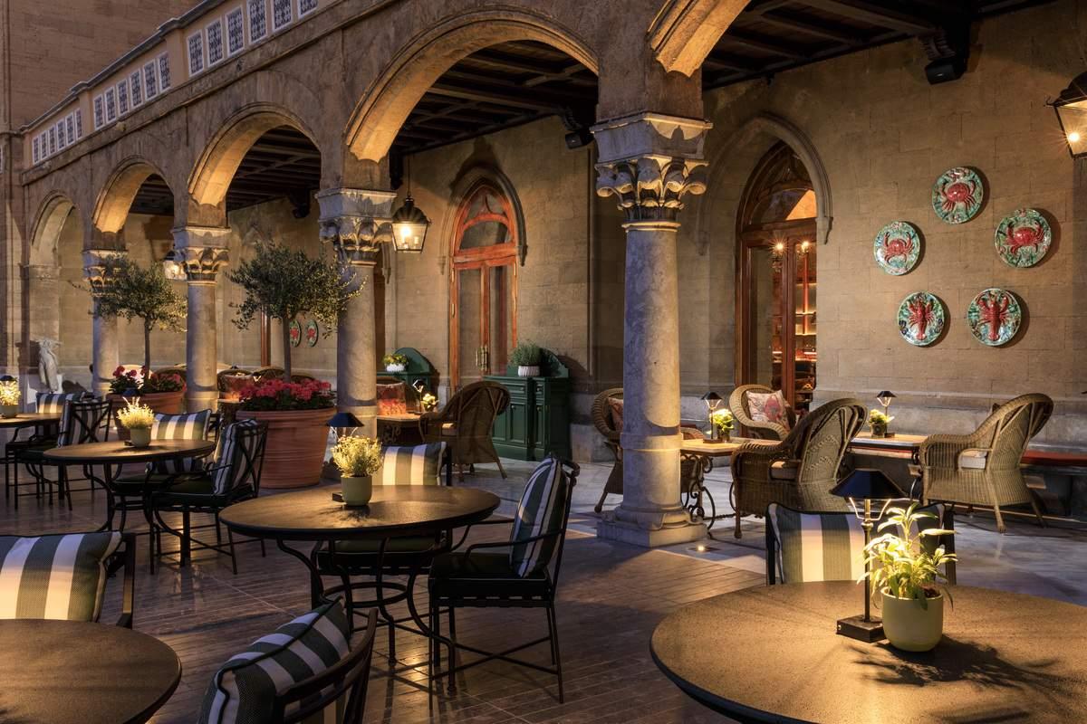 A patio with tables and chairsDescription automatically generated