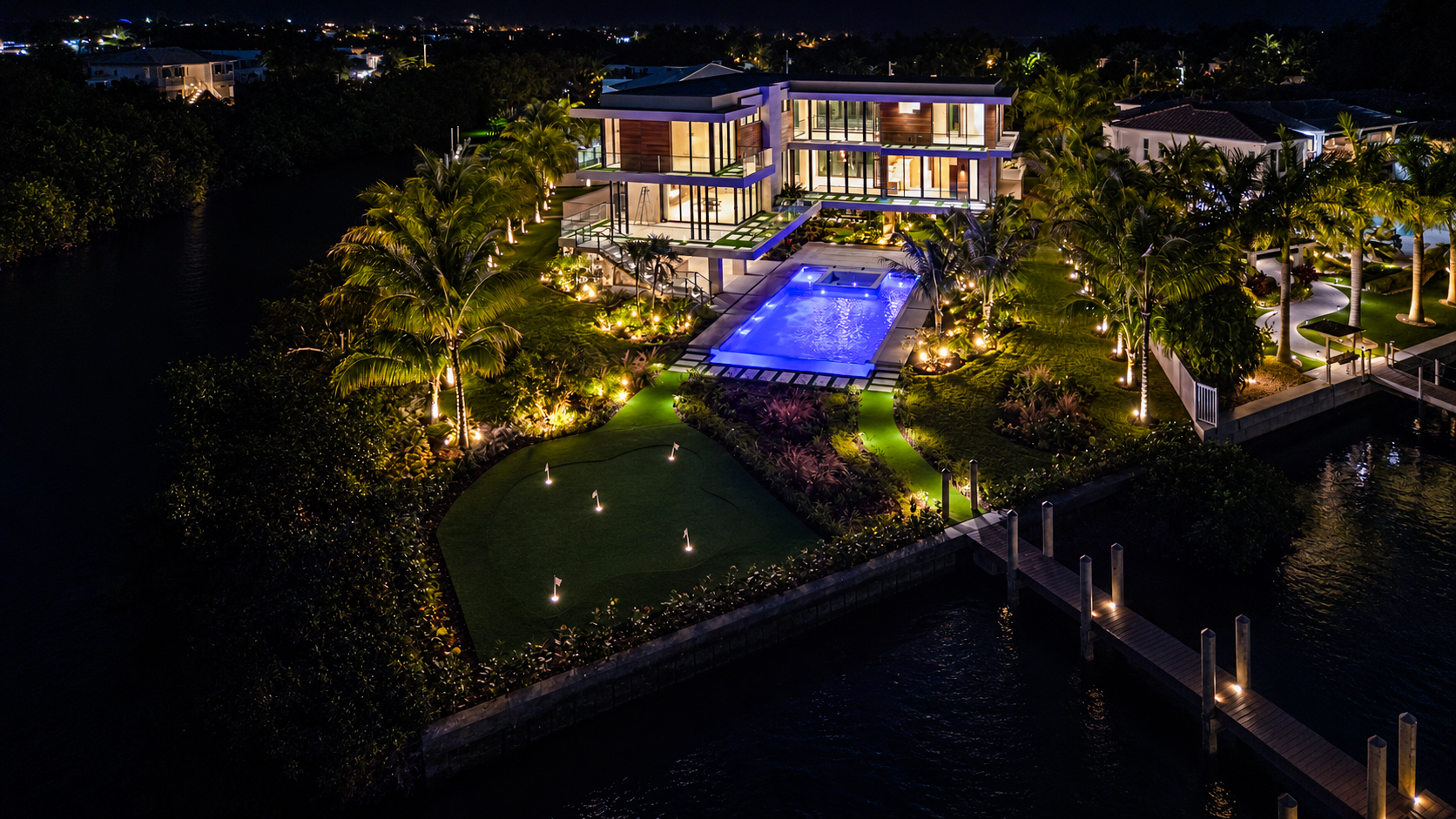 260 15th Circle, Key Colony Beach, aerial view of the waterfront estate, pool and canal at night