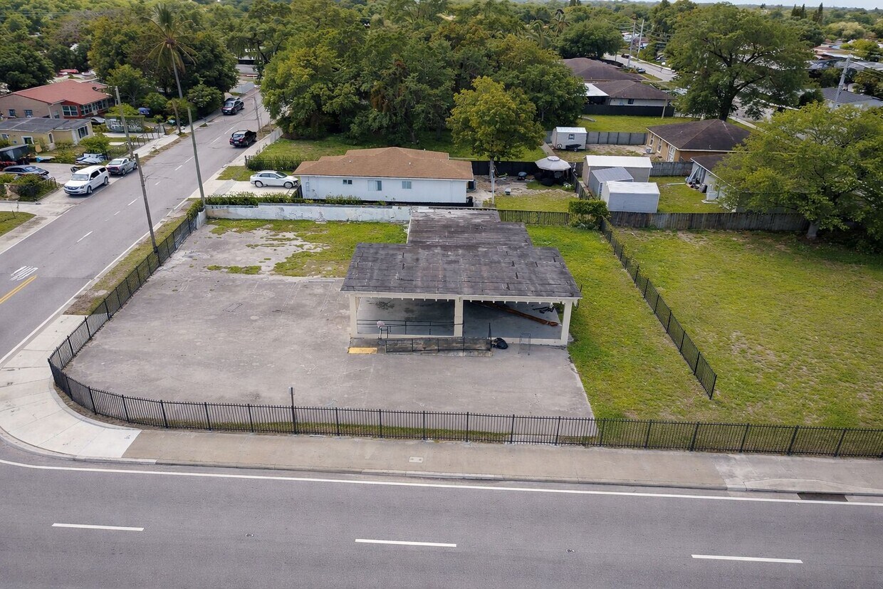 17010 NW 27th Ave, Miami Gardens, fenced lot and building from the street