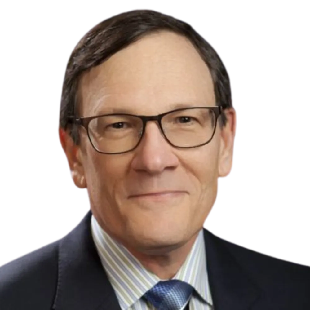 Headshot of a male with glasses and dressed in a dark suit with grey and white striped dress shirt and blue tie. 