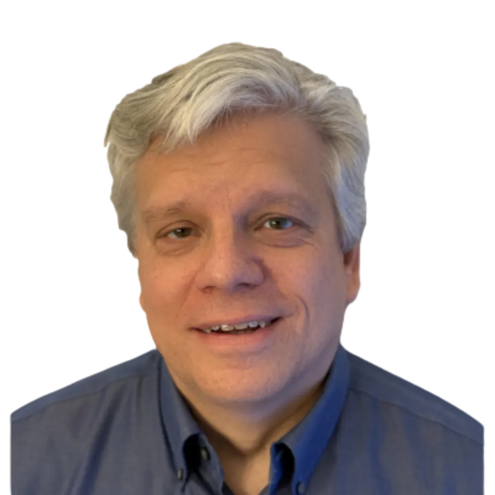 Headshot of a male with a blue button up shirt. 