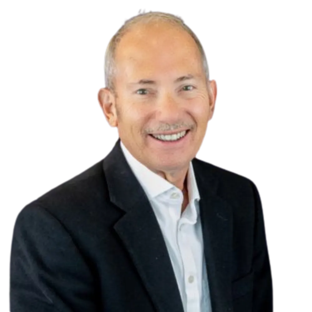 Headshot of a man with a mustache in a suit jacket and white collard shirt. 