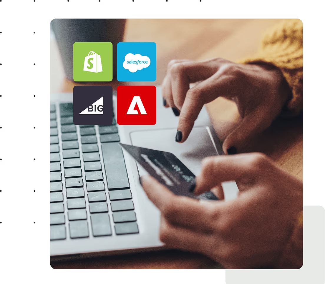 a laptop open with a set of hands holding a credit card. Ecommerce partners logos are displayed in the corner of the image.