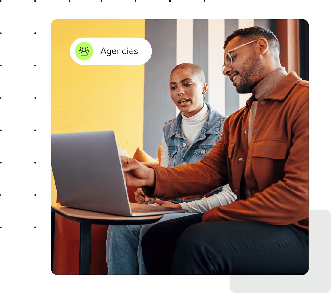 2 people looking at a laptop. 'Agencies' is displayed in text in the corner of the image.