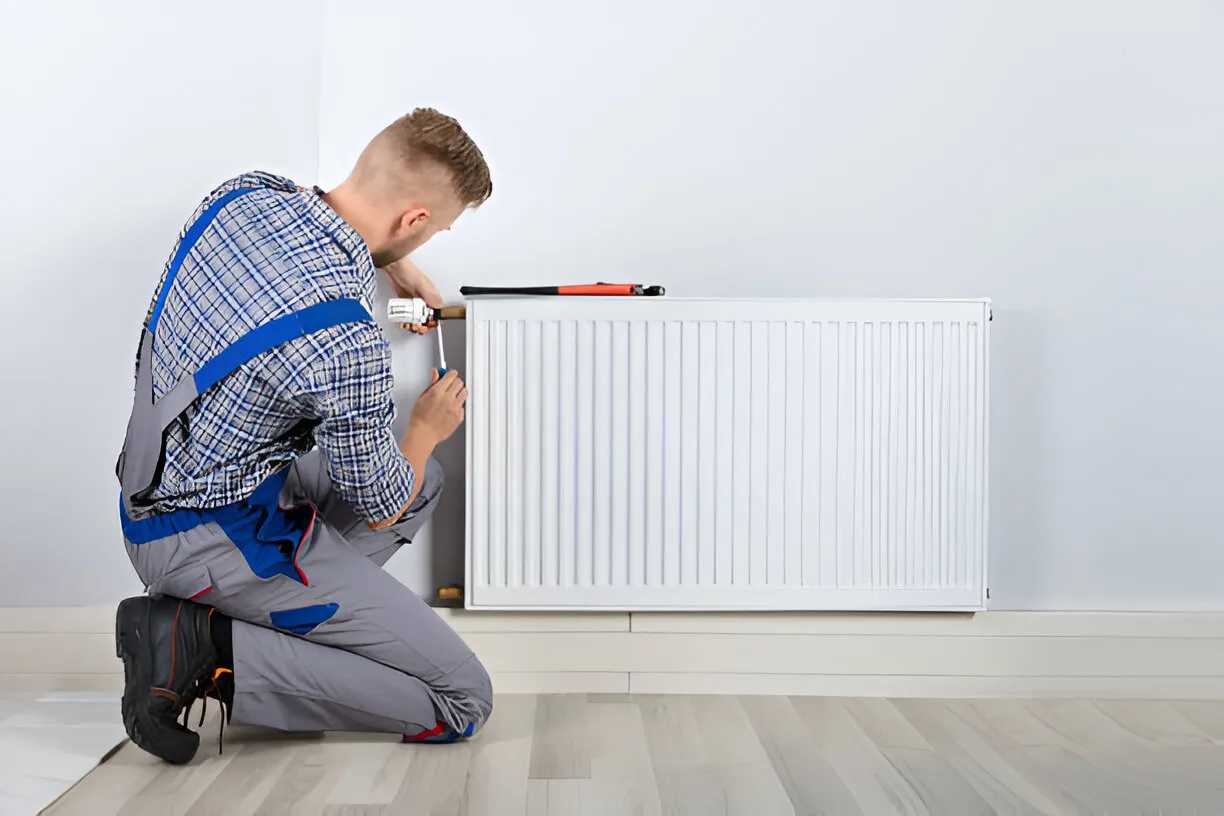 A technician fixing the outdoor AC Issue