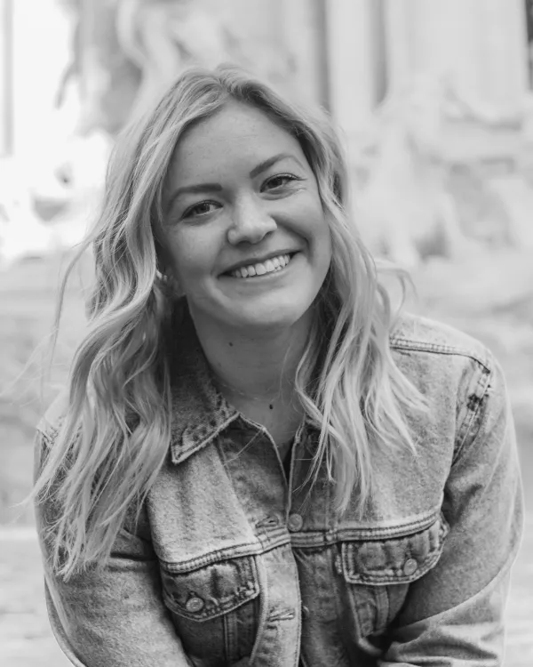 Black and white headshot of blonde women smiling