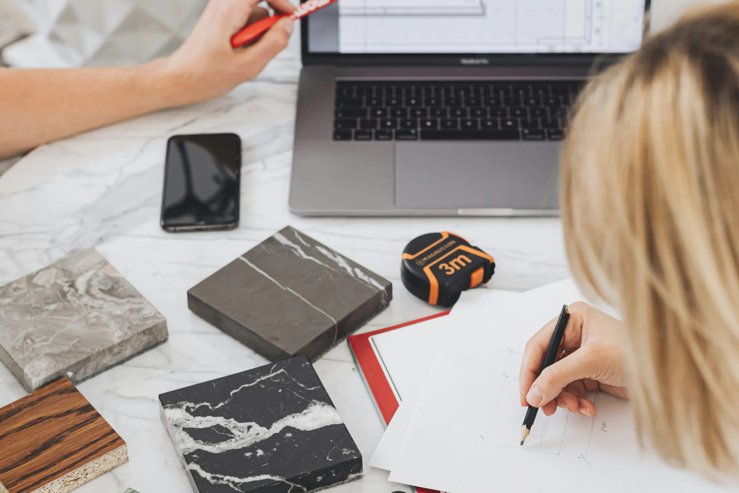 Designers working on project while looking at computer