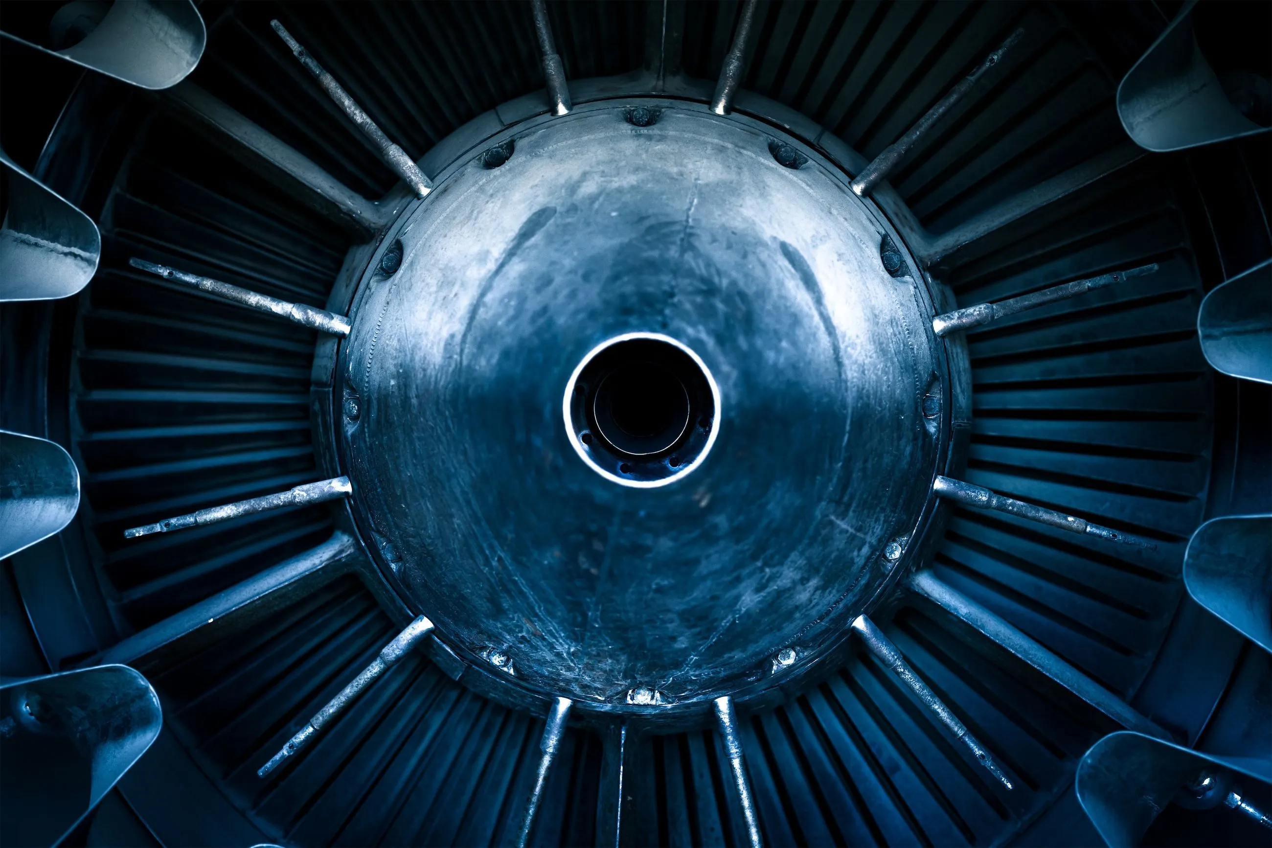 Close-up of turbine or engine component with metallic blades and center hub