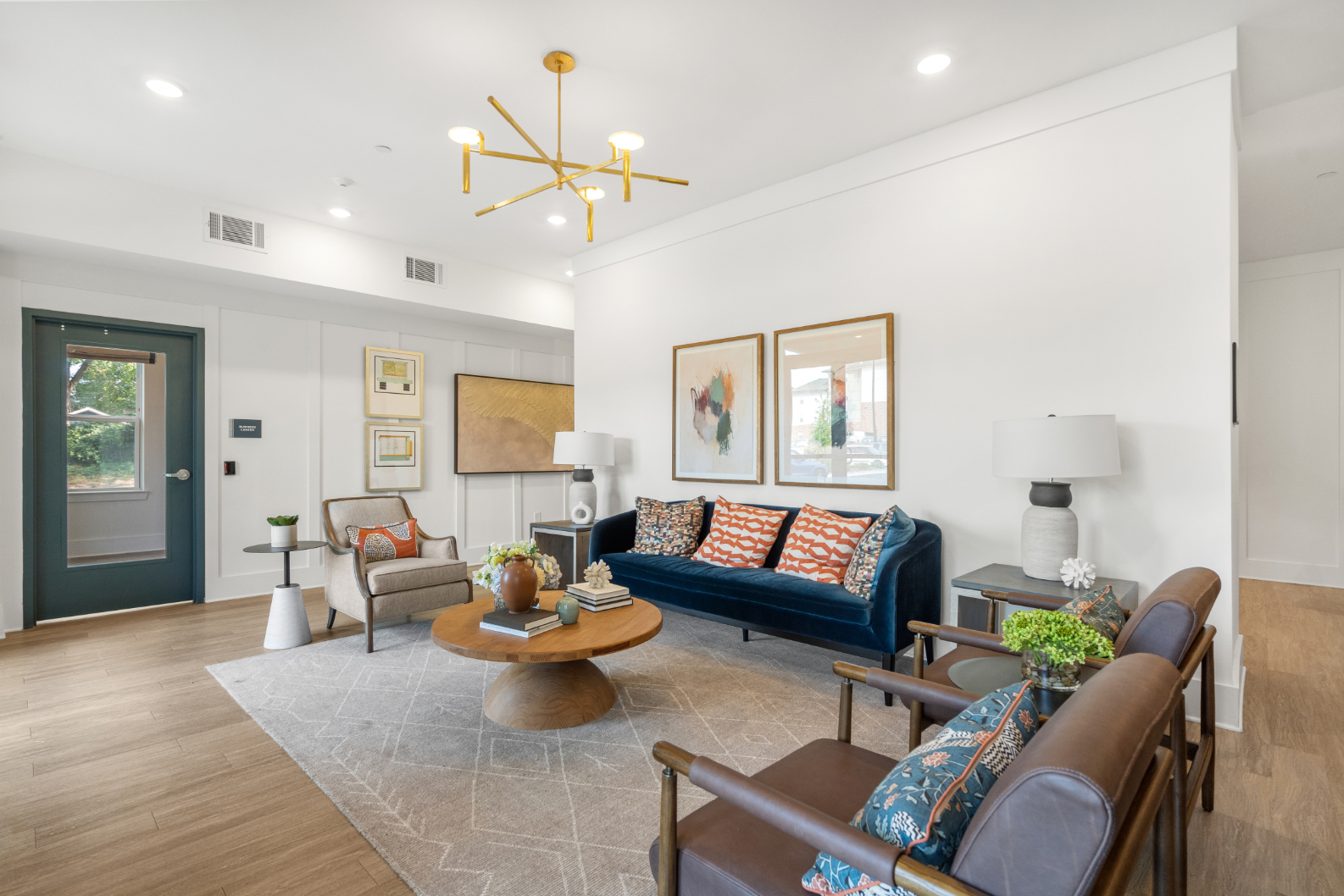 Lounge area with sofas, coffee table and large windows