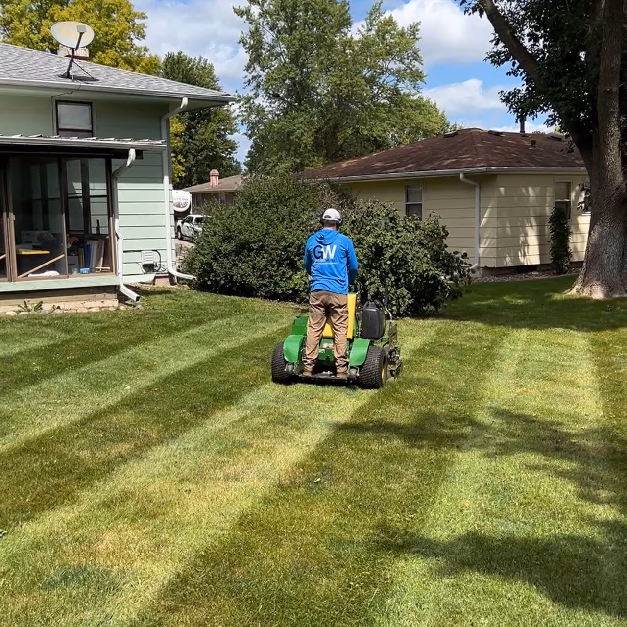 Professional lawn maintenance crew from Ground Works Lawn Care and Landscaping