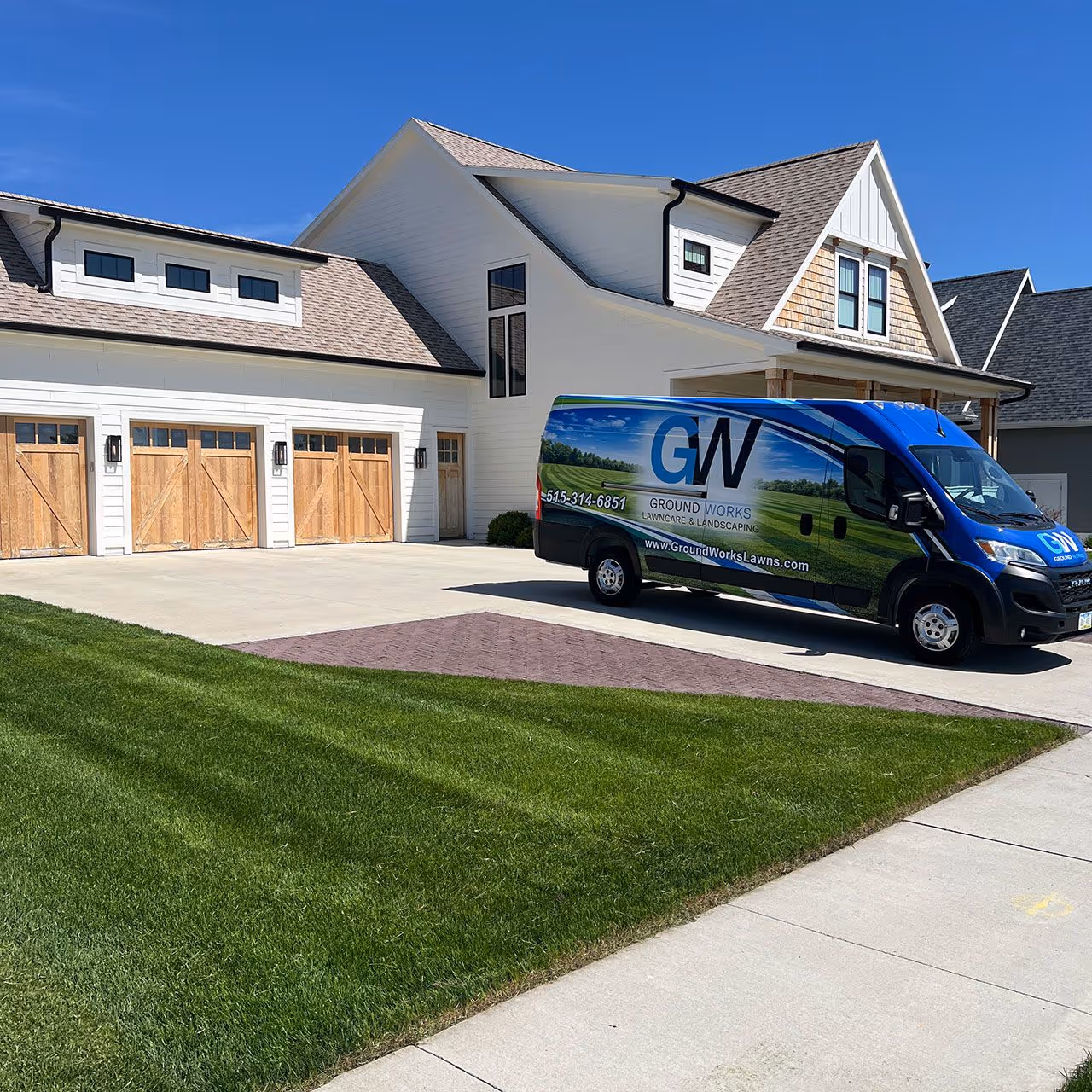 Freshly mowed lawn with professional edging by Ground Works Lawn Care and Landscaping