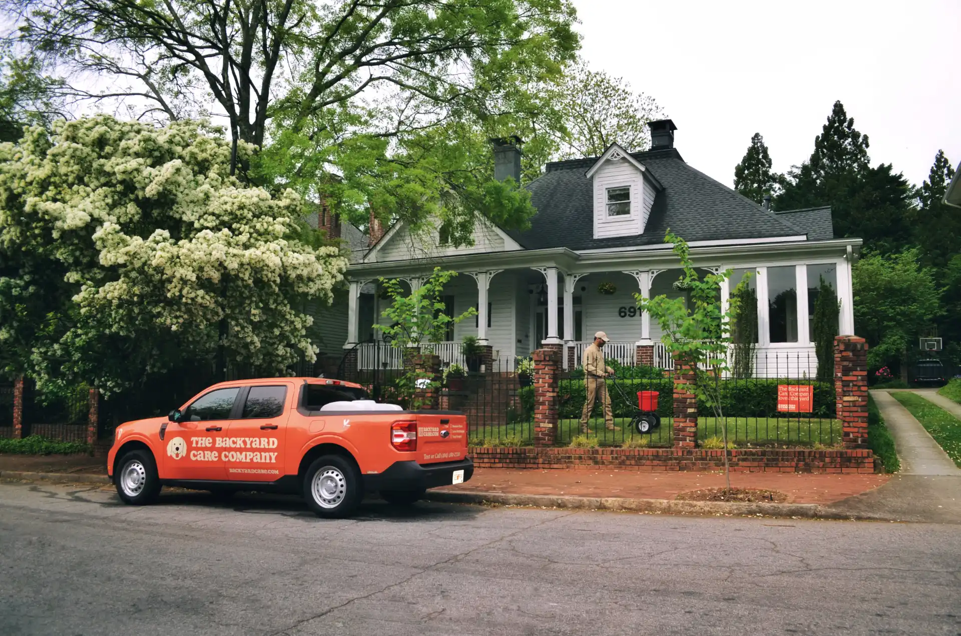 Orange car with house in the background