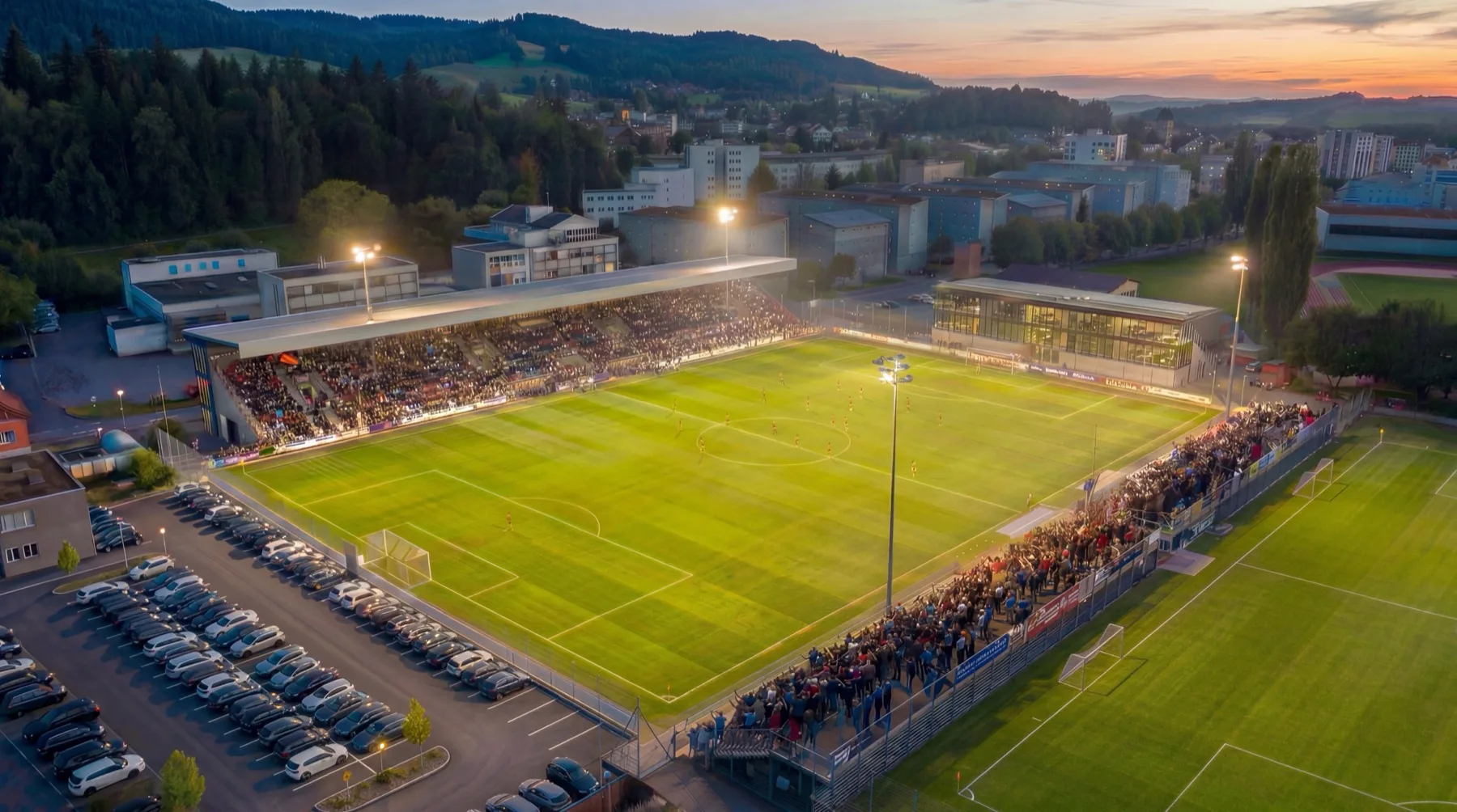 The planned TexWax Sportpark of FC Rotkreuz under floodlight