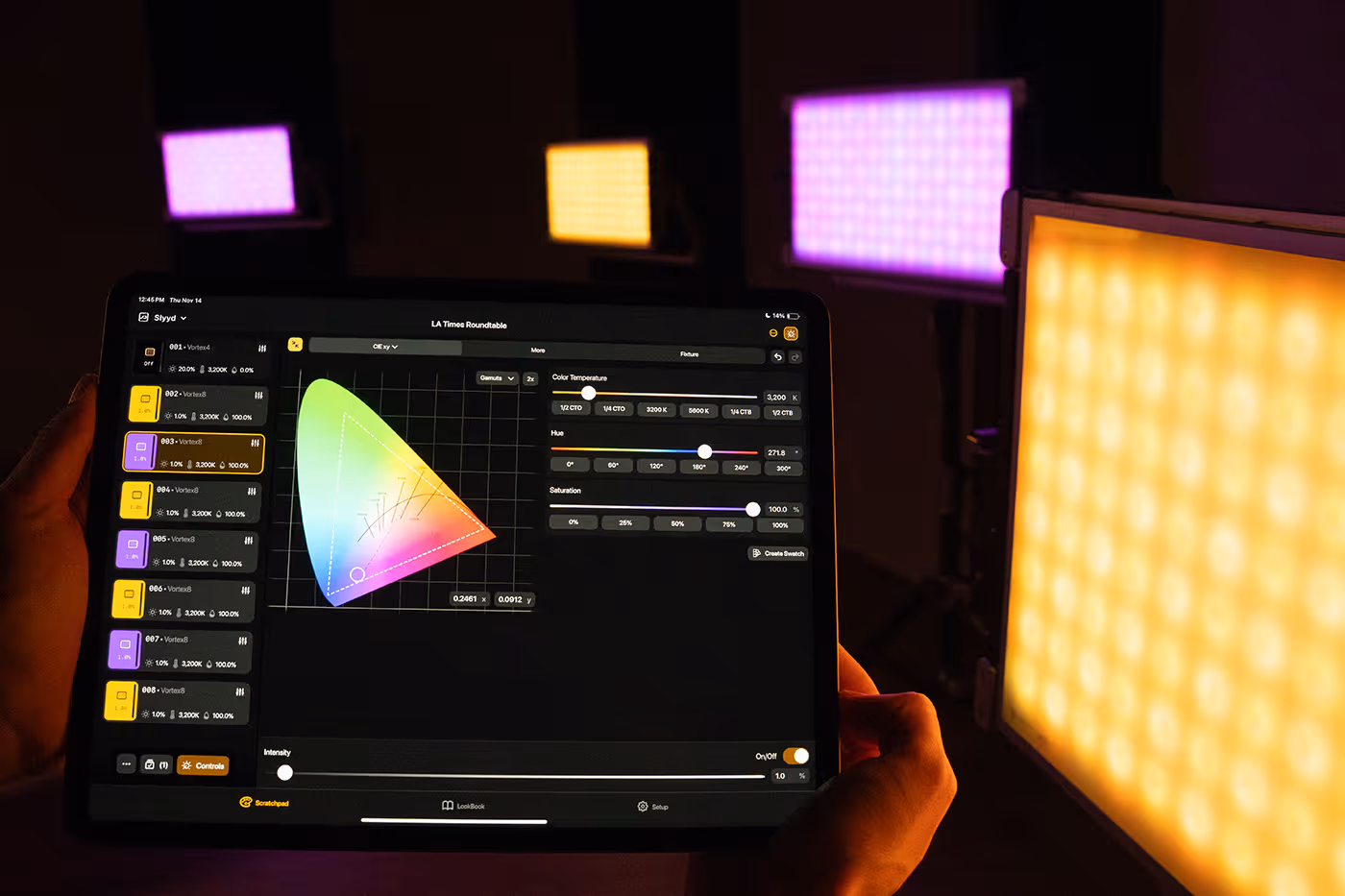 Slyyd wide on iPad with light fixtures in the background