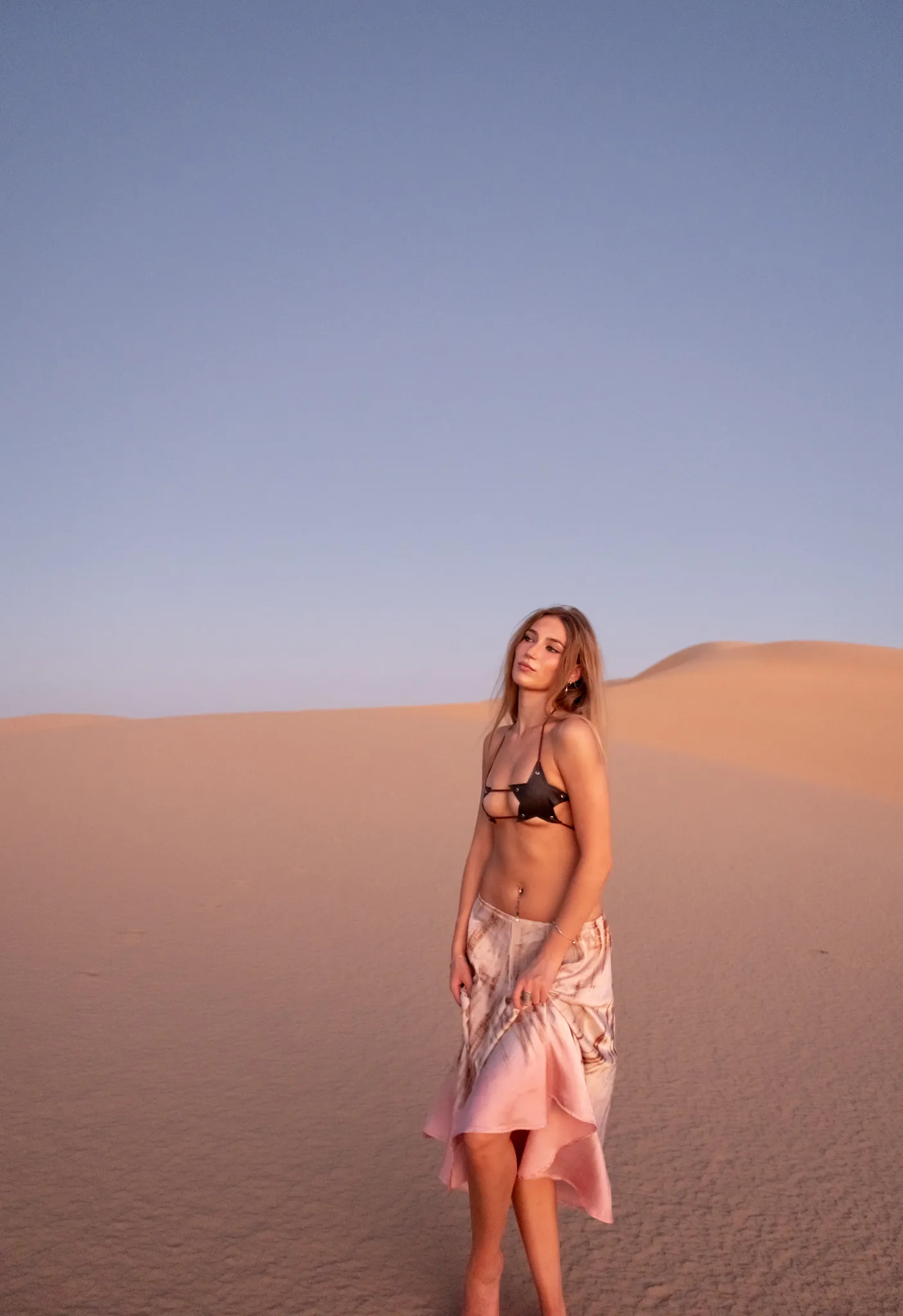 Fashion lifestyle portrait of model wearing apparel in sand dunes by San Diego brand photographer Kanyon Studio