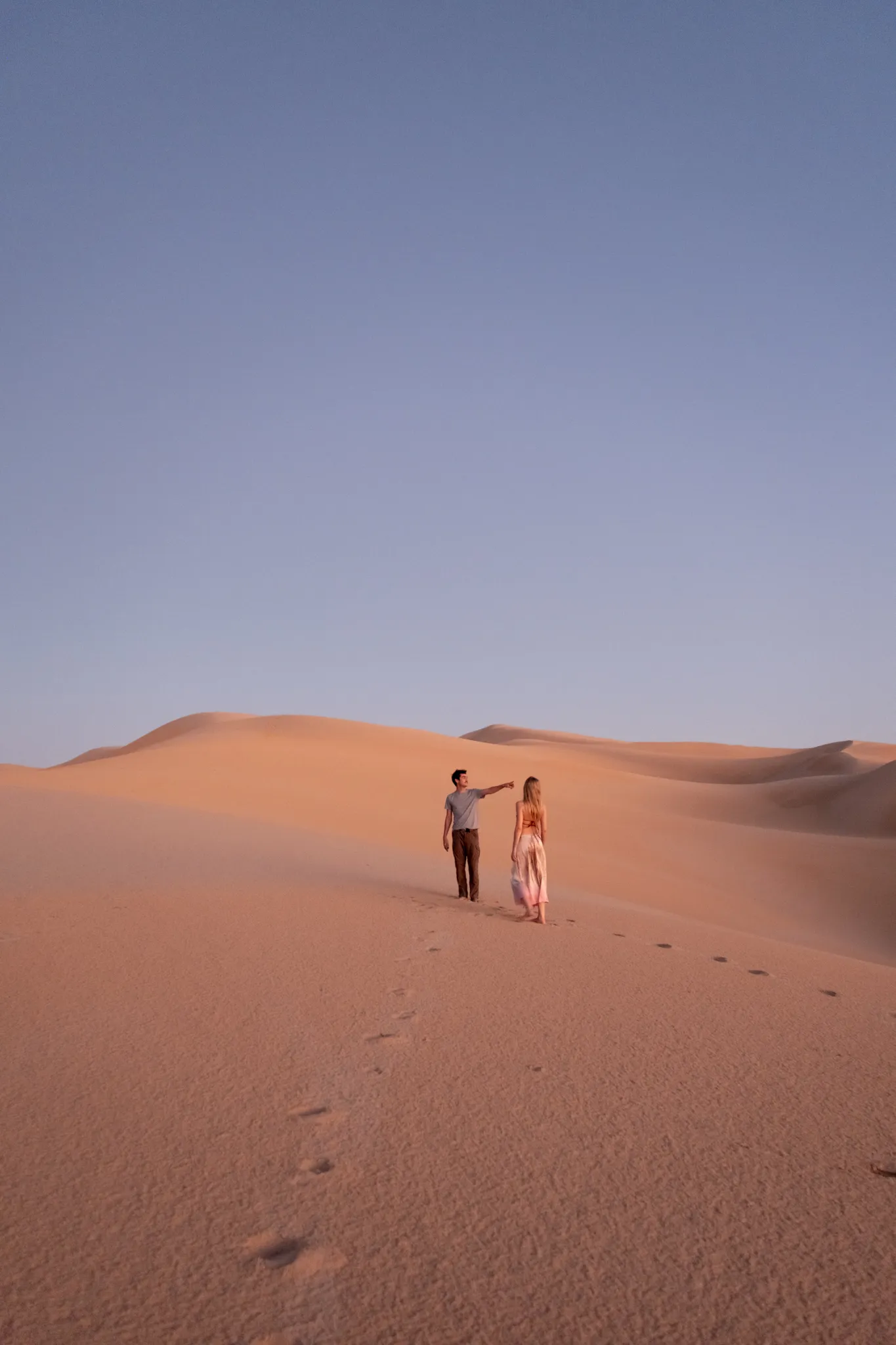 Lifestyle portrait photography of models posing in a sand dune environment by San Diego photographer Kanyon Studio