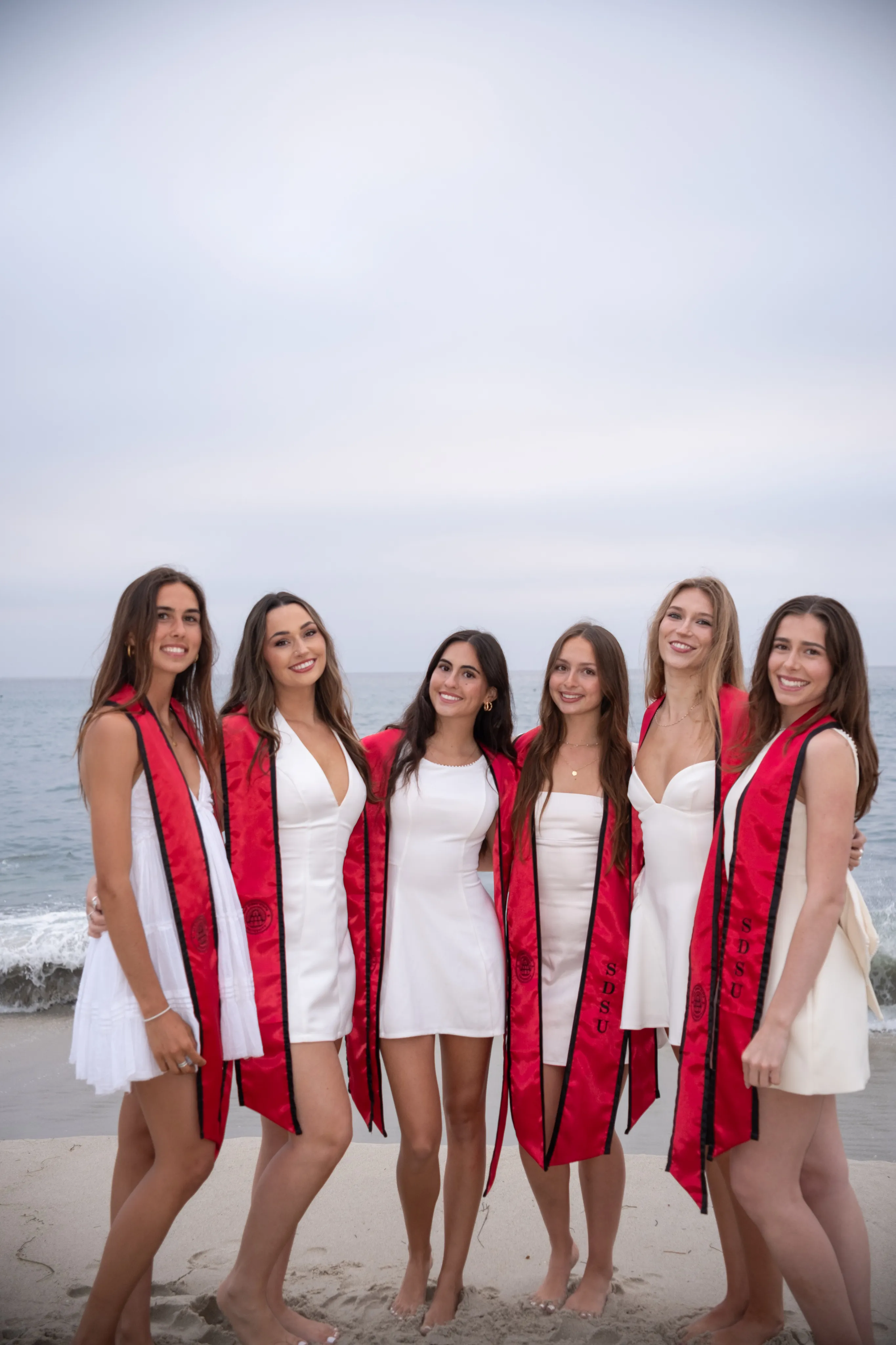 Beach graduation portrait — photography by Kanyon Studio