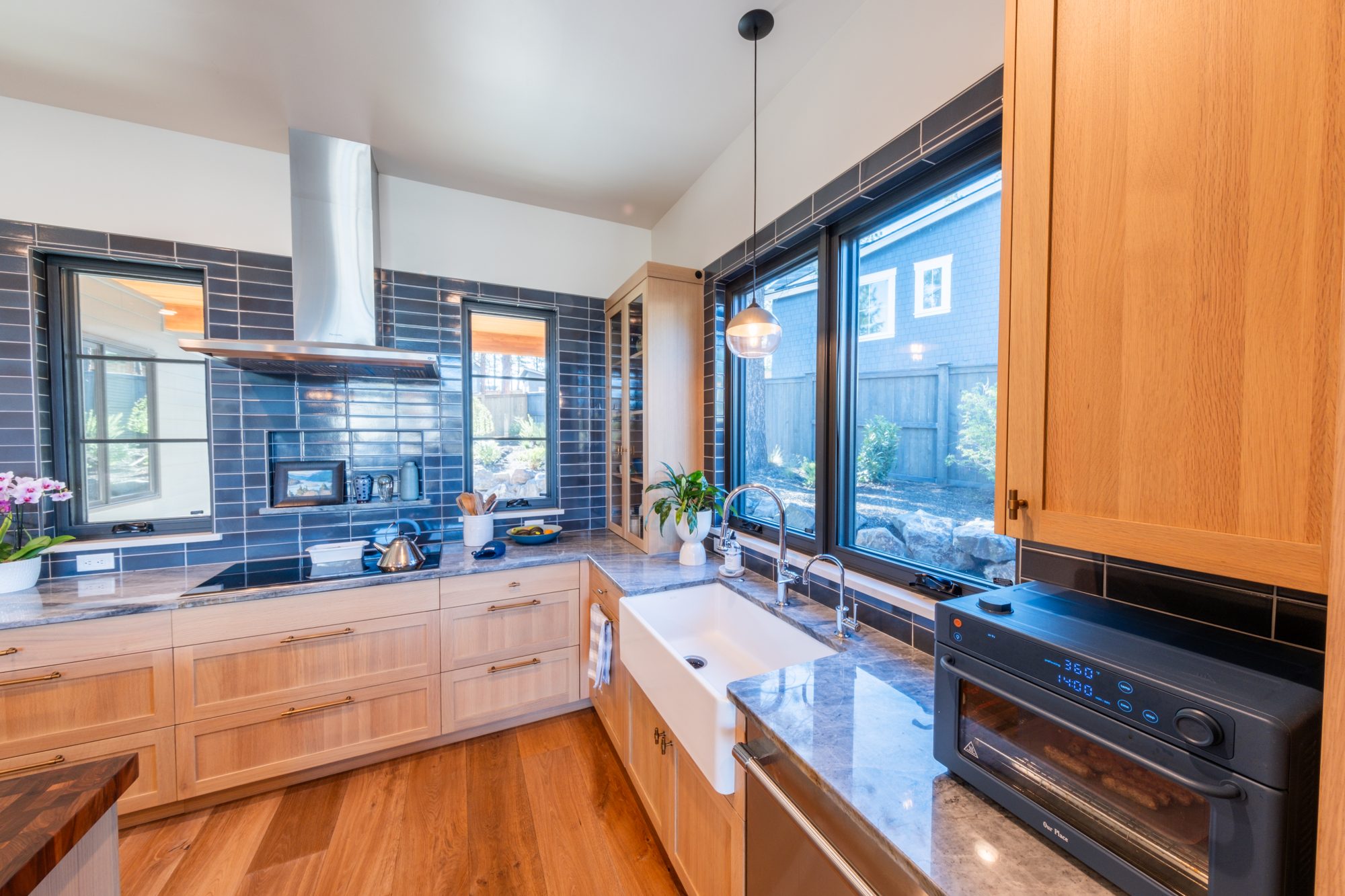 Kitchen with farmhouse sink and window over counter