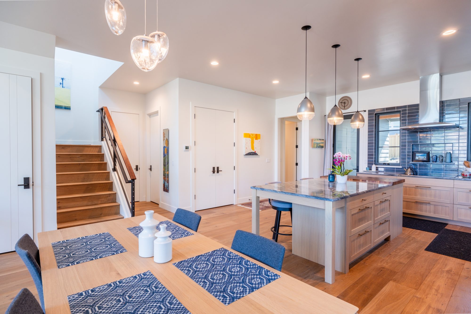 Open-plan living room with fireplace and vaulted ceiling
