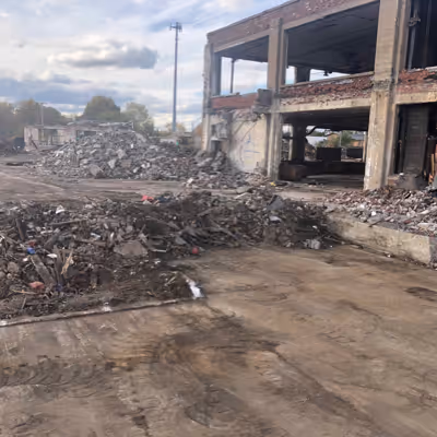 Scraps of a destroyed building, with debris scattered.
