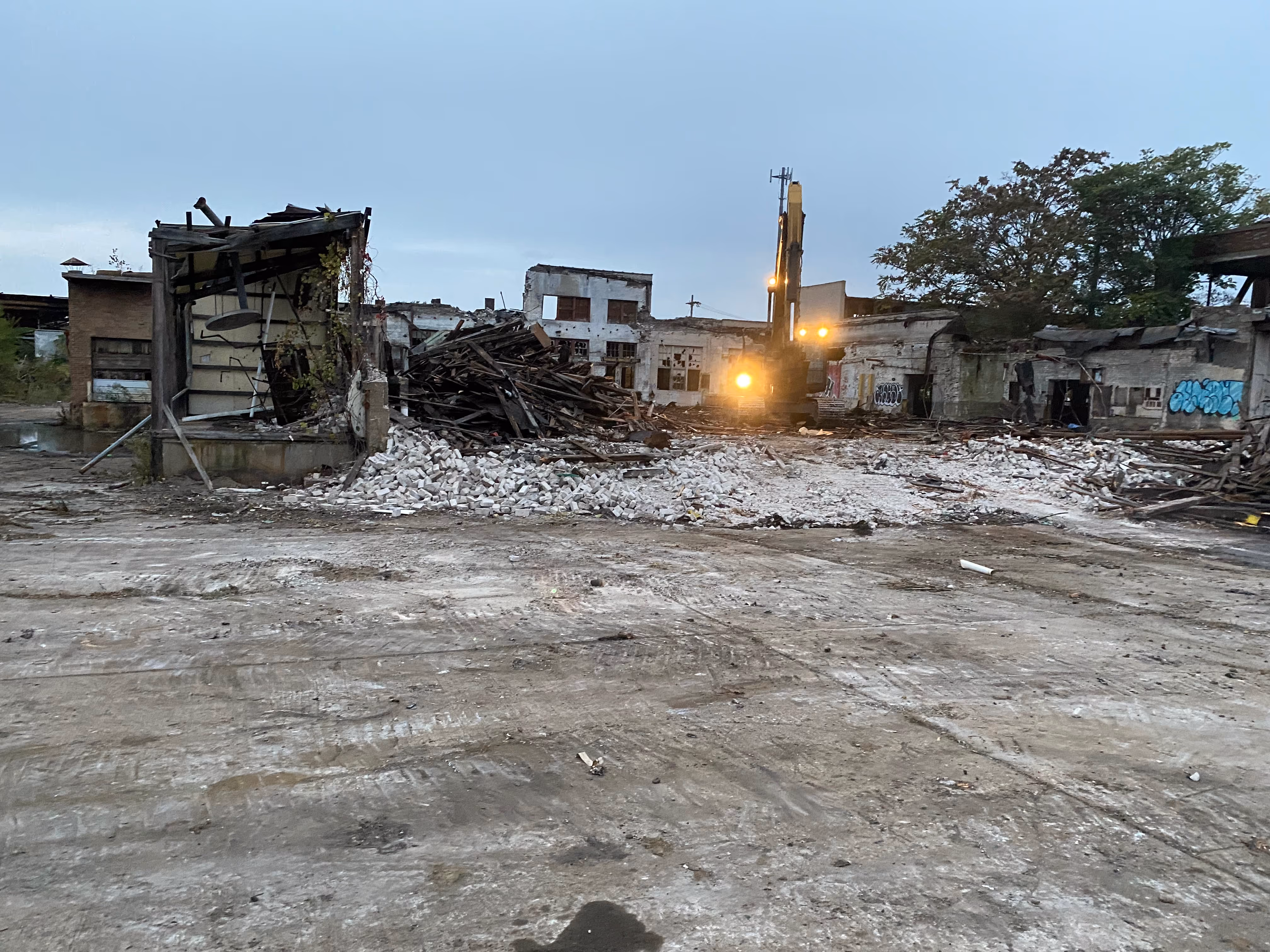 Ruins of destroyed buildings, with debris scattered and walls partially collapsed.