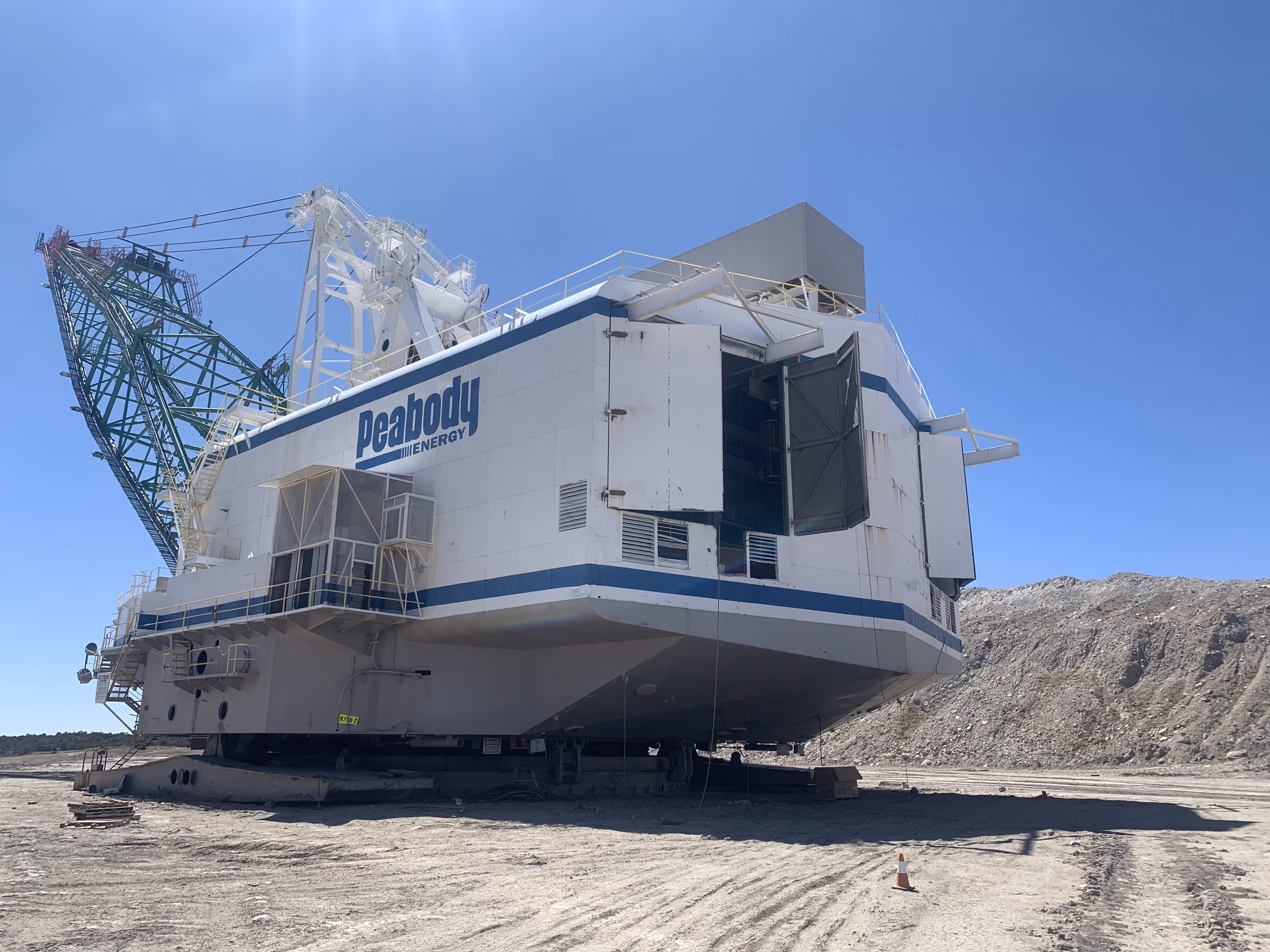 A white Peabody coal machinery ready to be taken apart.