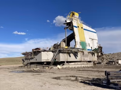 A white Peabody coal machinery being deconstructed. 