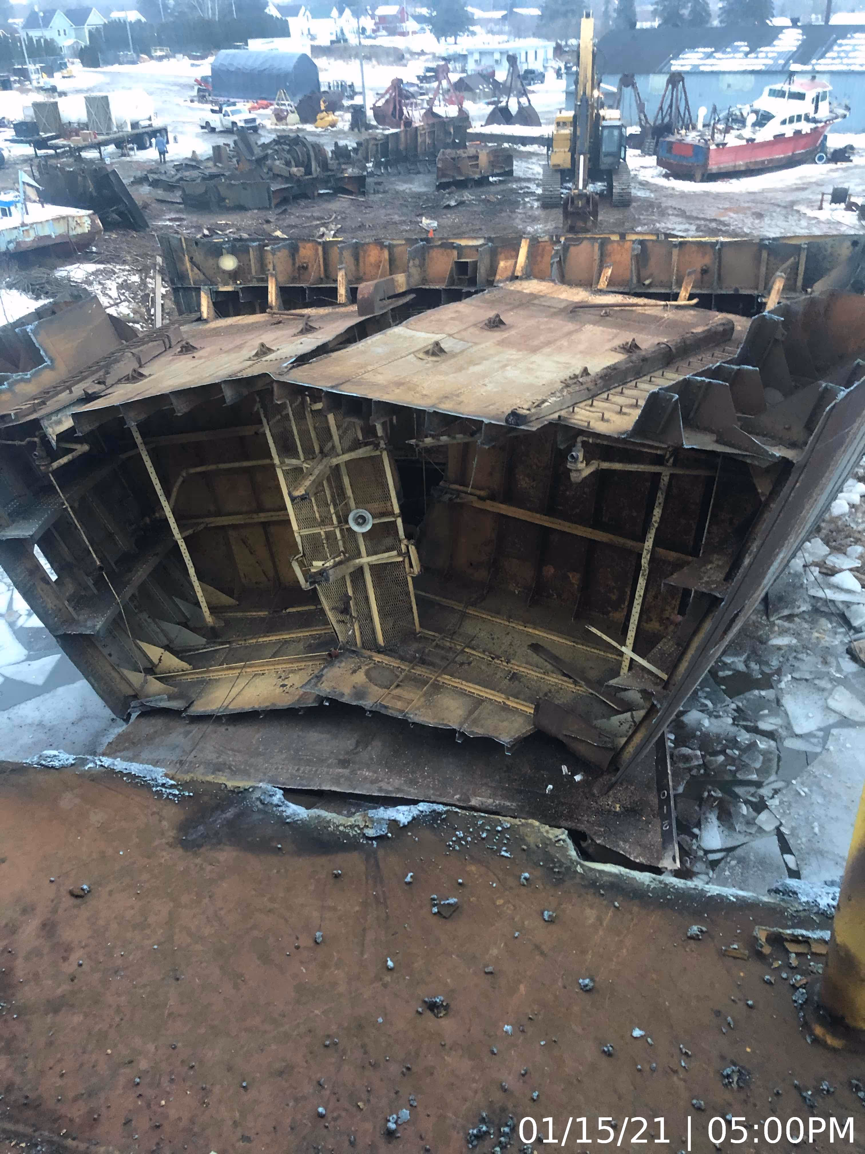 A rusted part of a large ship ready to be deconstructed.