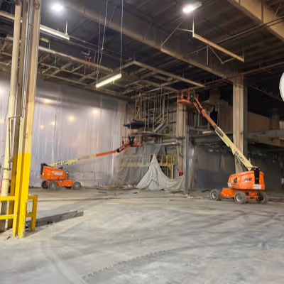 Two Cranes in a concrete warehouse