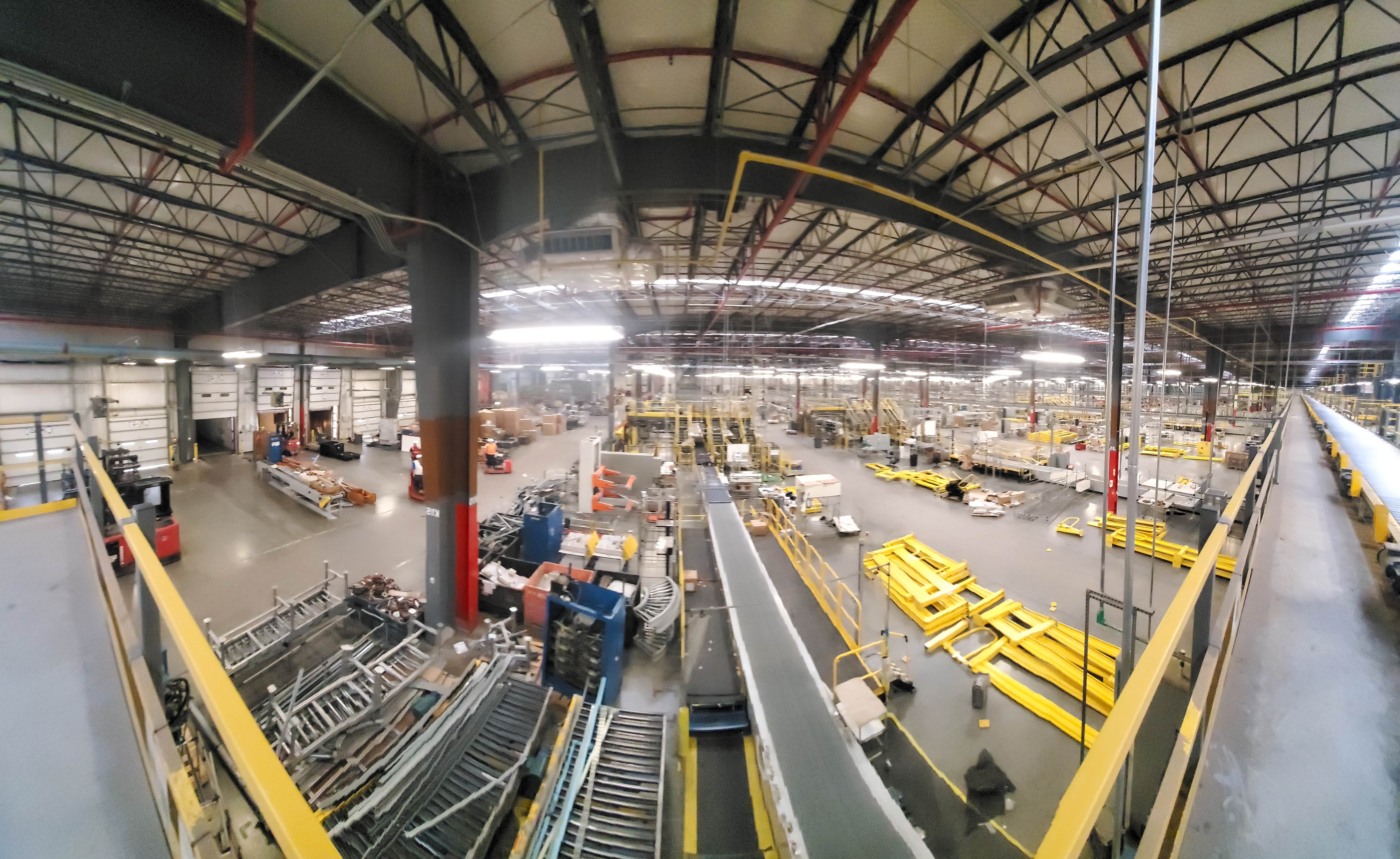 Interior industrial dismantling project in progress with safety systems in place