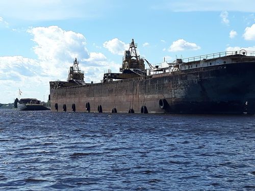 A large ship sits in the water.