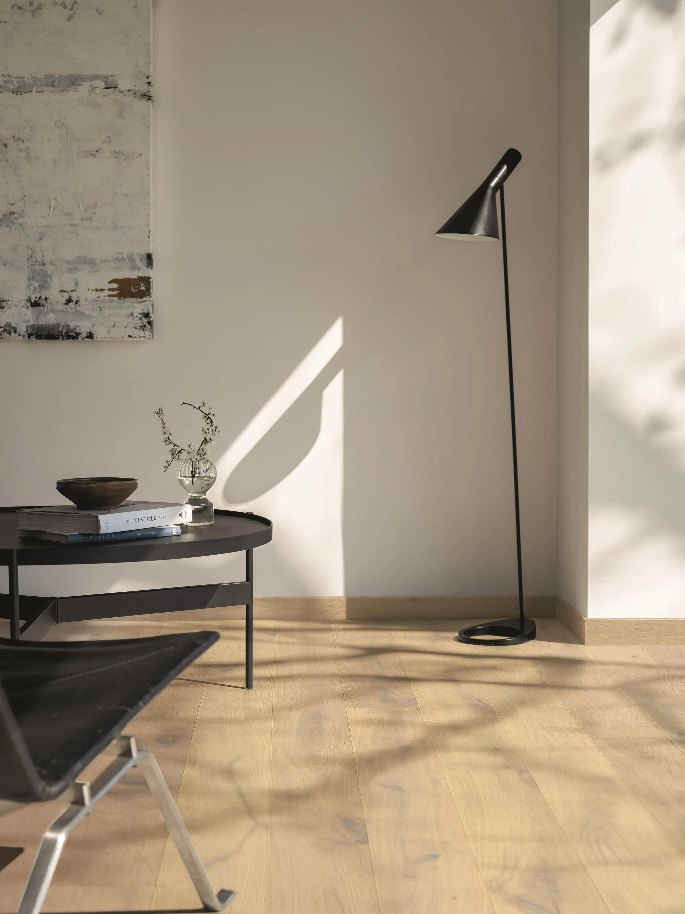 a black lamp next to a table