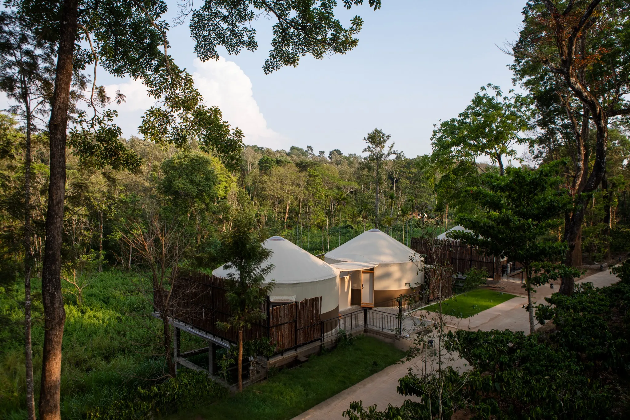 Twin yurts with private decks at a modern glamping resort