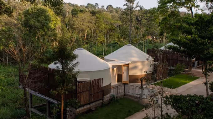 Modern luxury yurts by The Out Factory nestled in lush forest at Machaan eco-resort, Nagarhole
