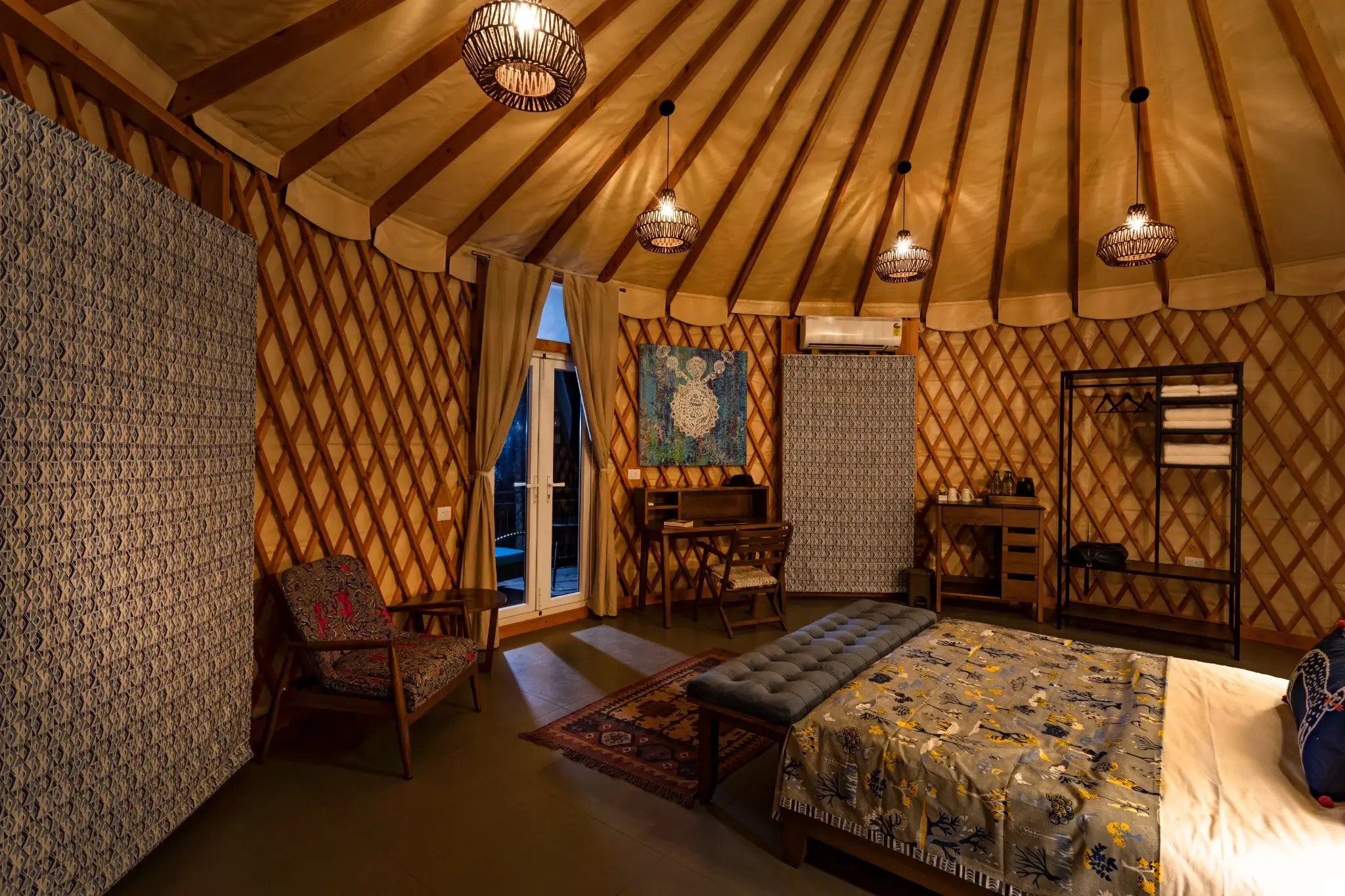 Modern twin yurts with private fenced decks nestled in a serene forest setting