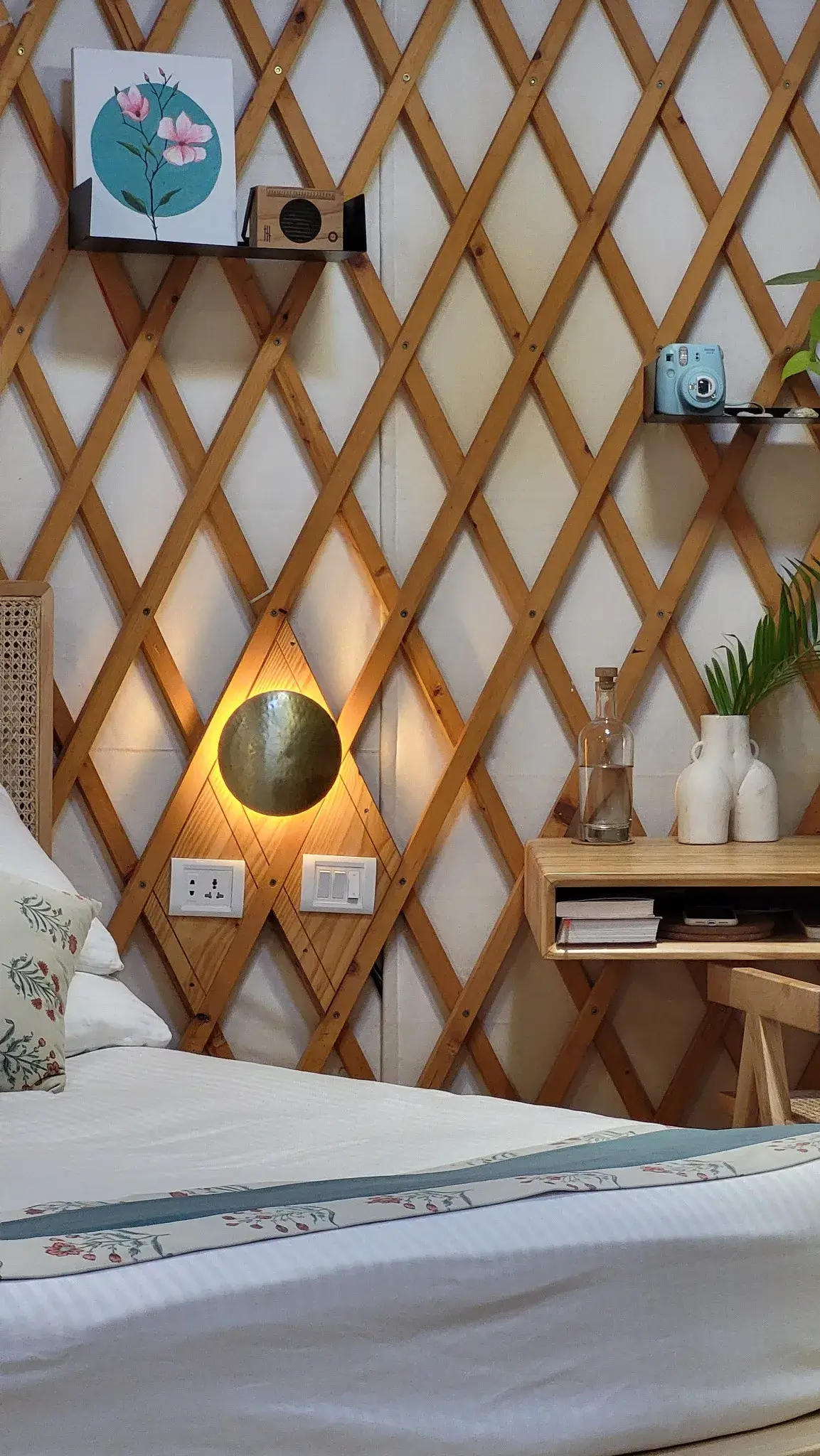 Elegant yurt bedroom with handcrafted wooden details, soft lighting, and stylish nature-inspired decor.