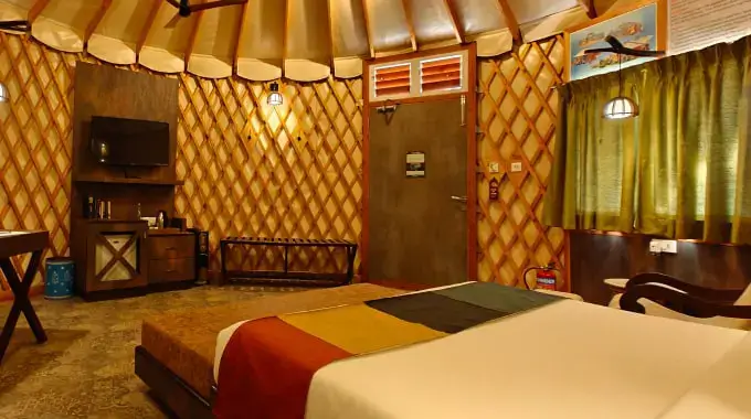 Luxury yurt interior with eco-friendly design and premium amenities at Tathastu Jungle Resort