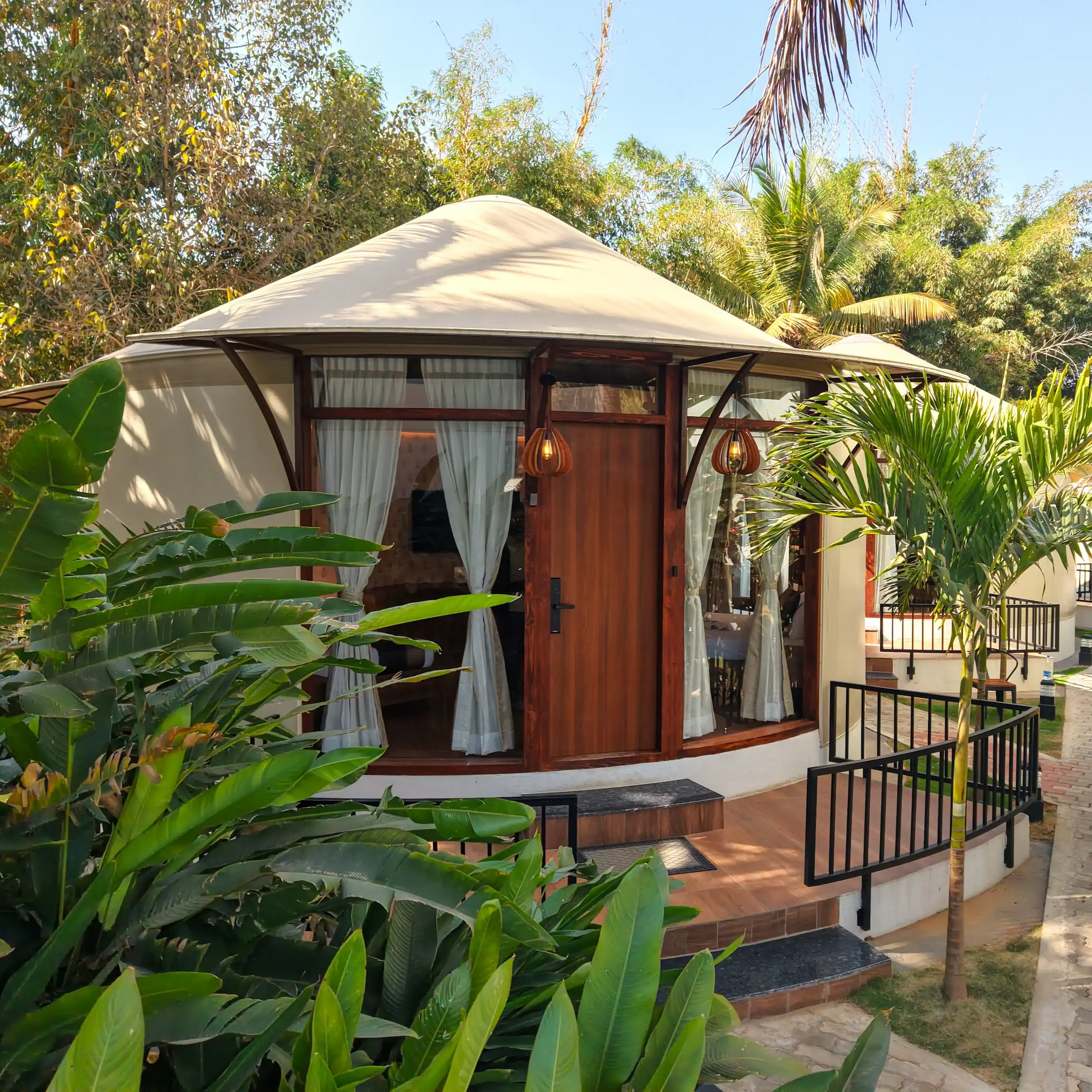Eco-friendly luxury yurt resort with modern accommodations and green surroundings