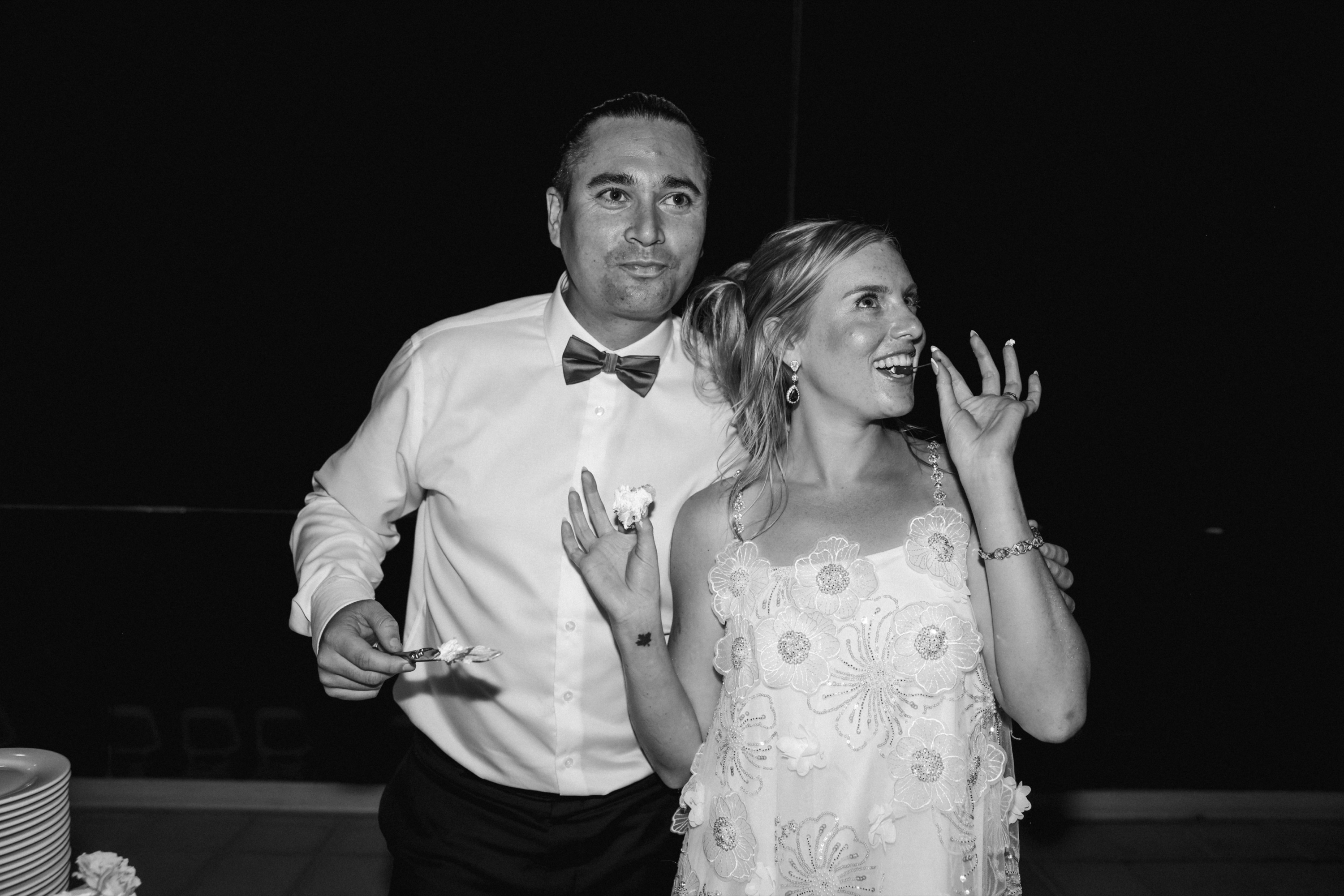 Wedding cake cutting ceremony, joyful celebration