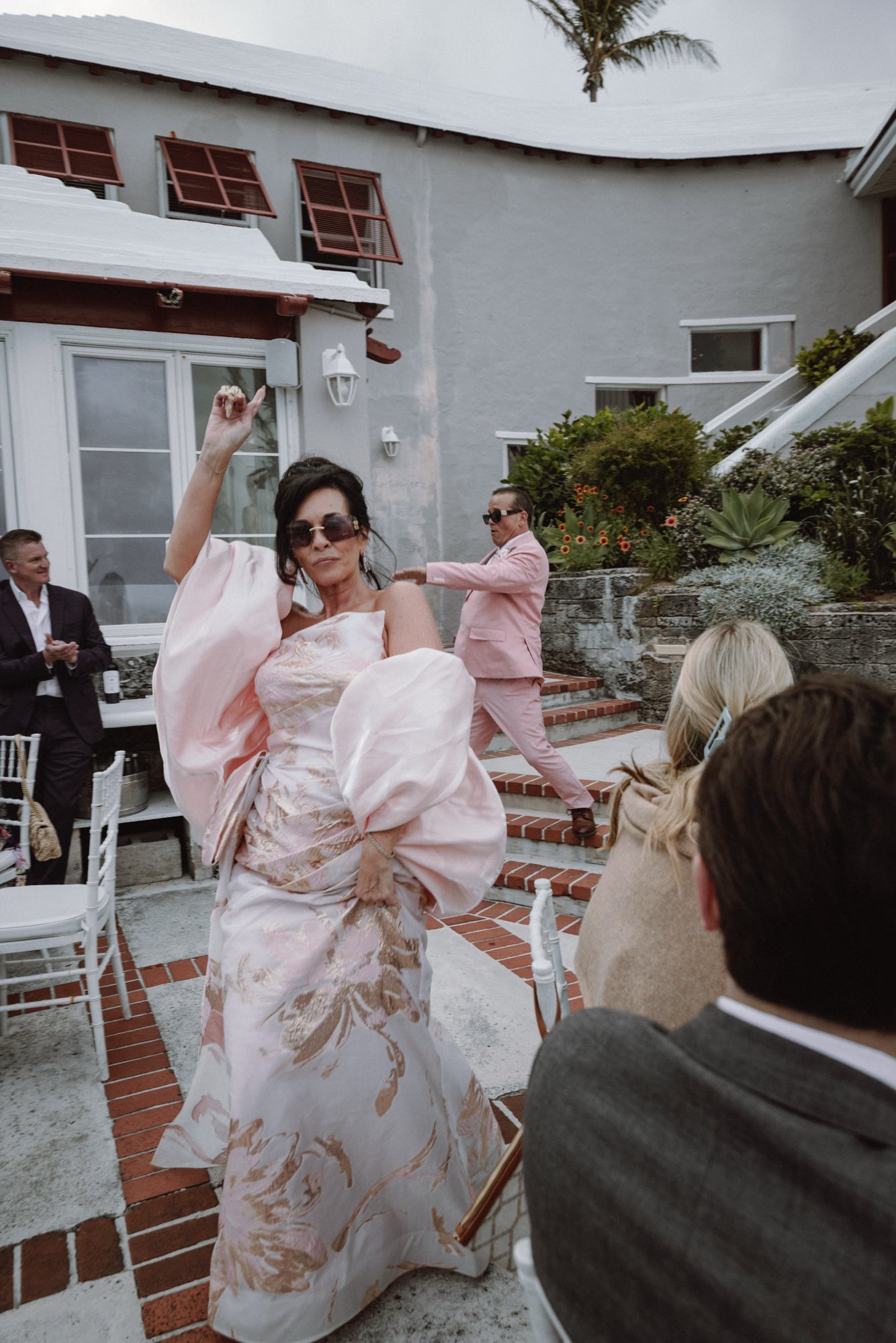 Candid joyful dance floor energy at outdoor Bermuda wedding reception